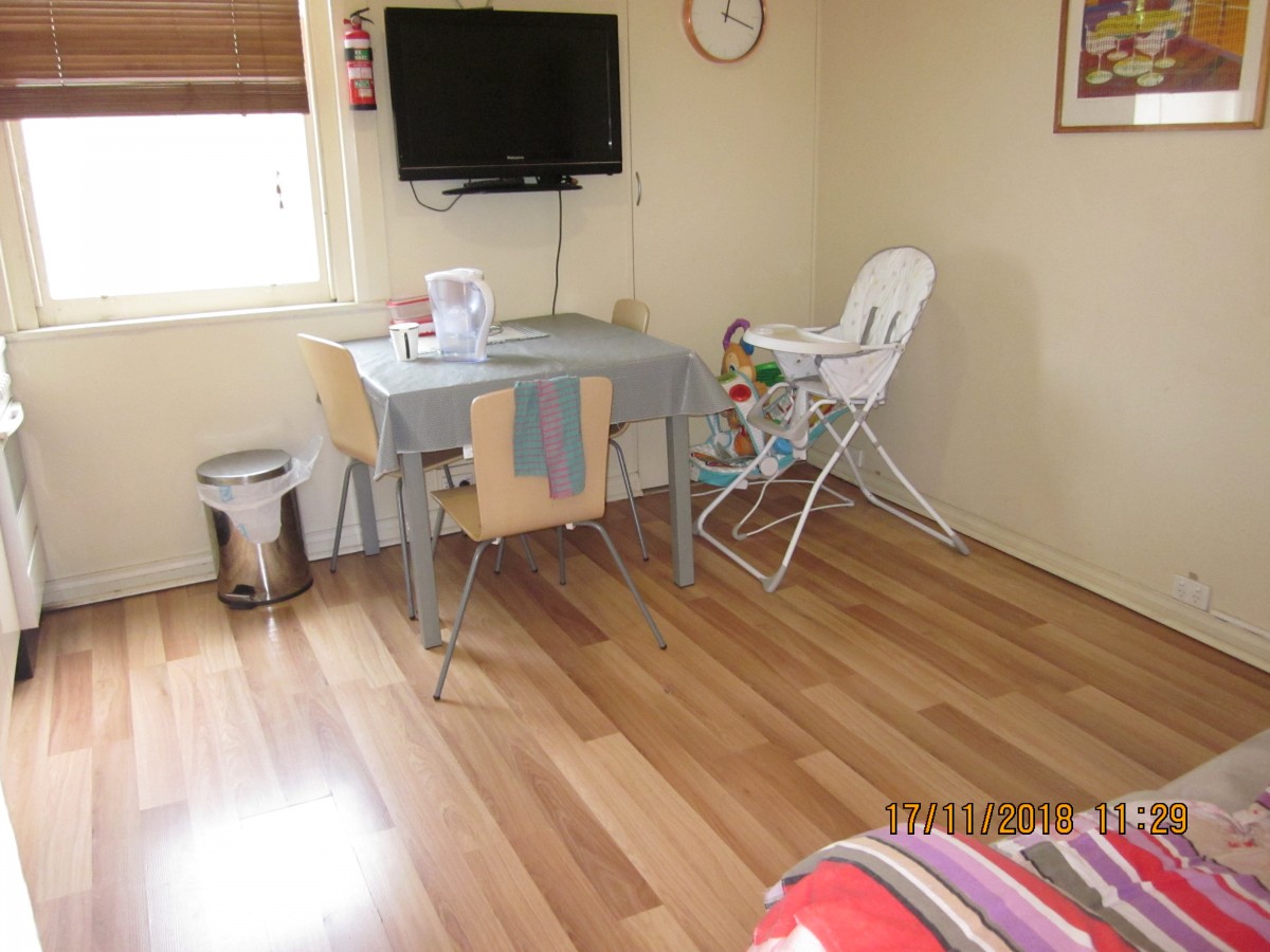 Flat 4 living area.with baby chairJPG.JPG